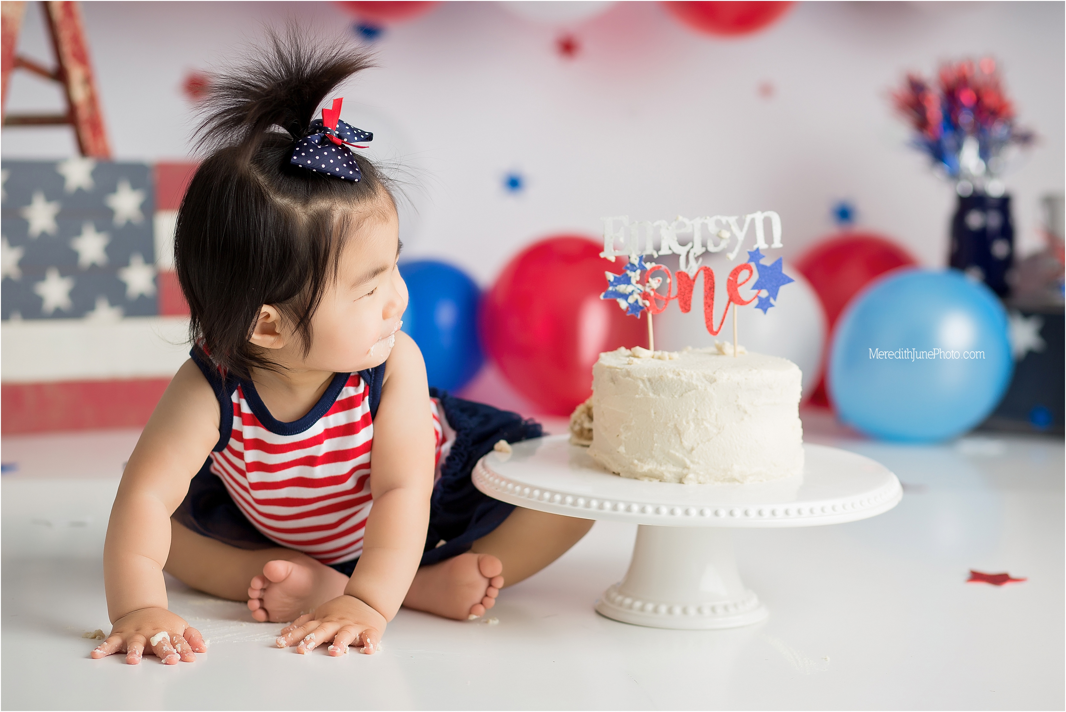 A red, white, and blue firework cake smash for a 4th of July baby